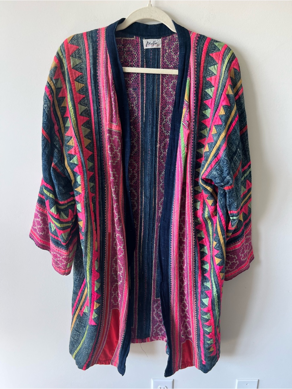 Koko Nor kimono cardigan tribal pattern against a dark indigo back handwoven